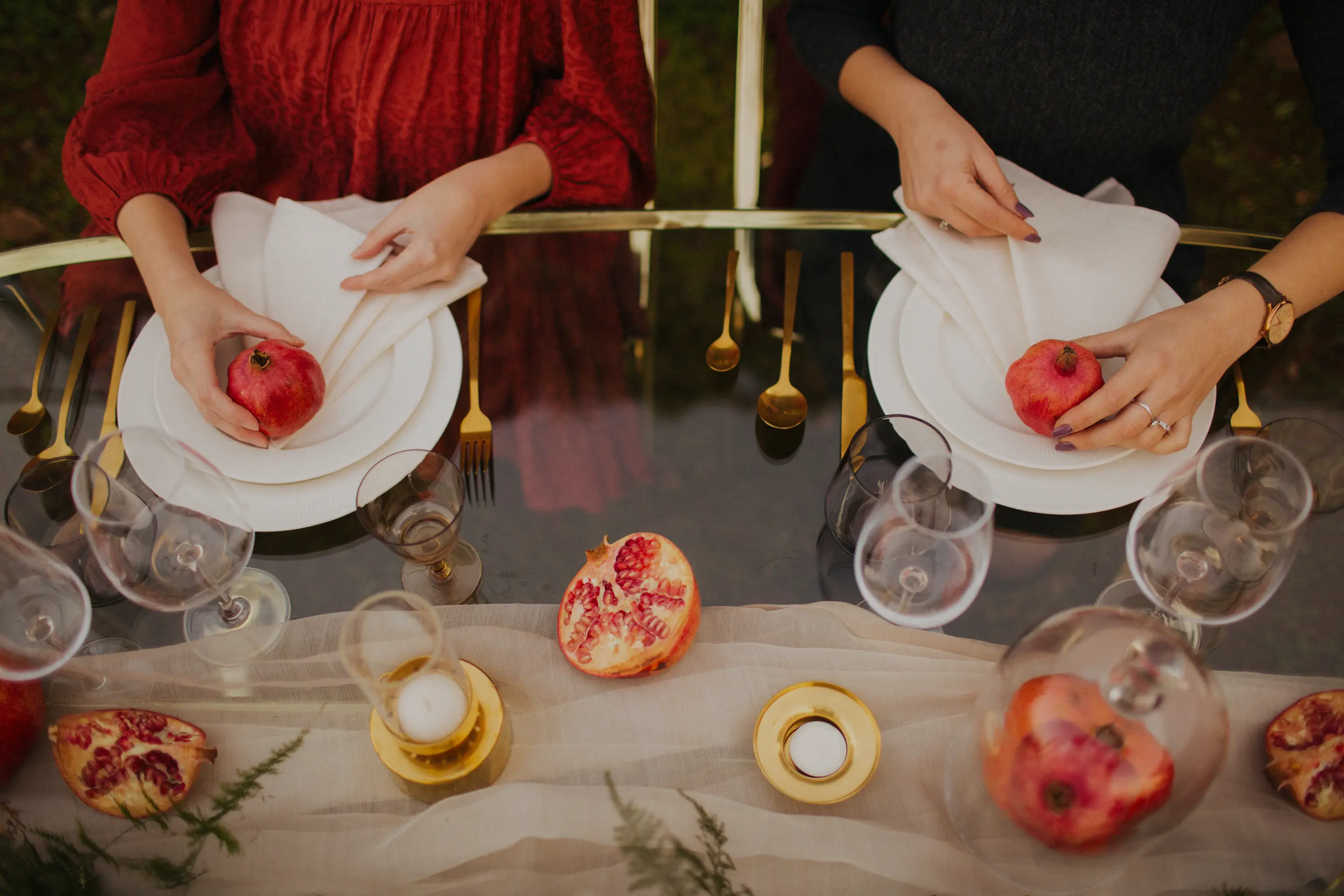 Nar Events wedding planners holding a pomegranate